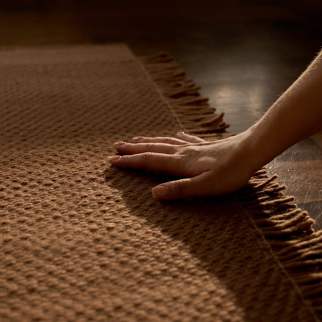 Hand touching a textured brown surface #sunsettan